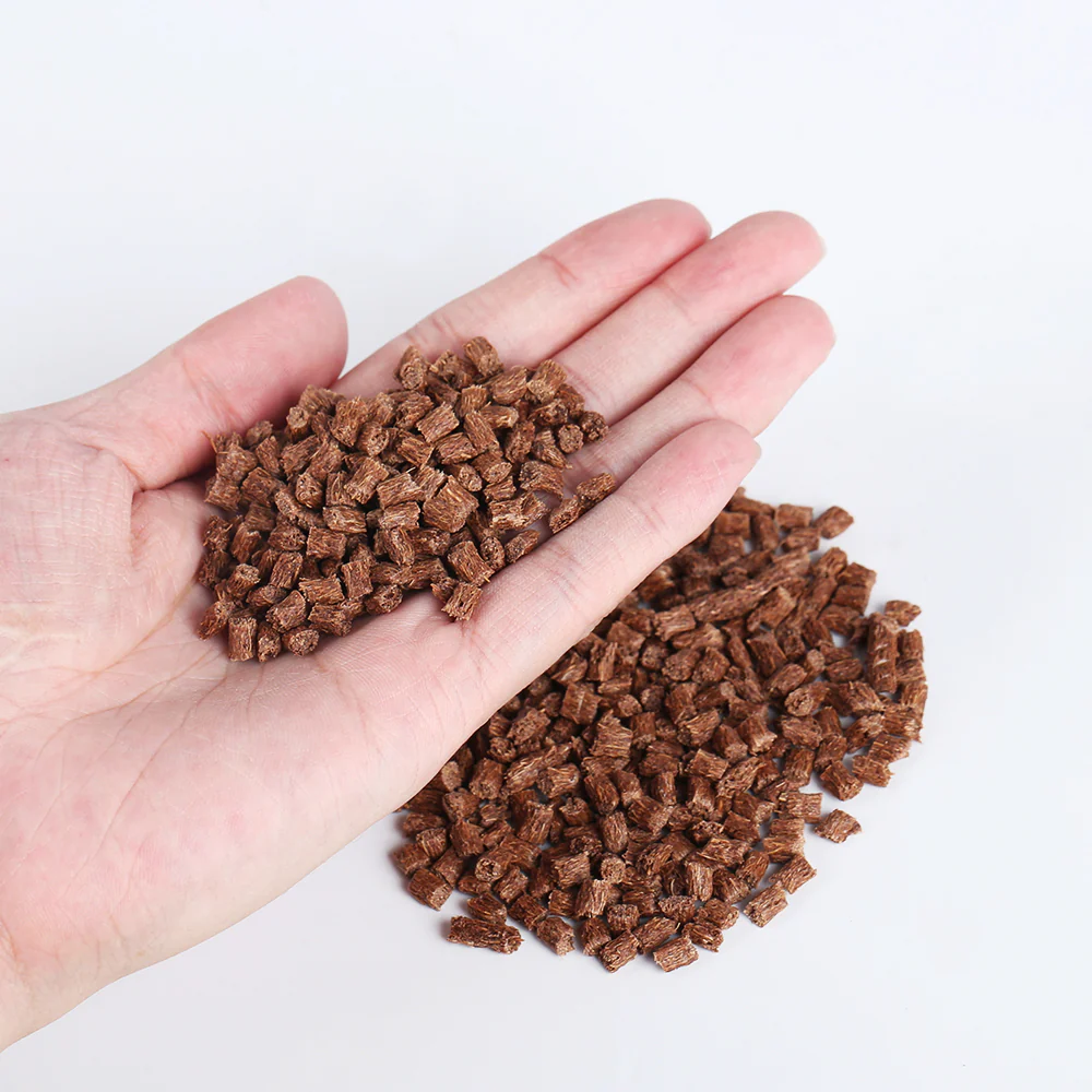 Coconut fiber PP masterbatch pellets held in hand