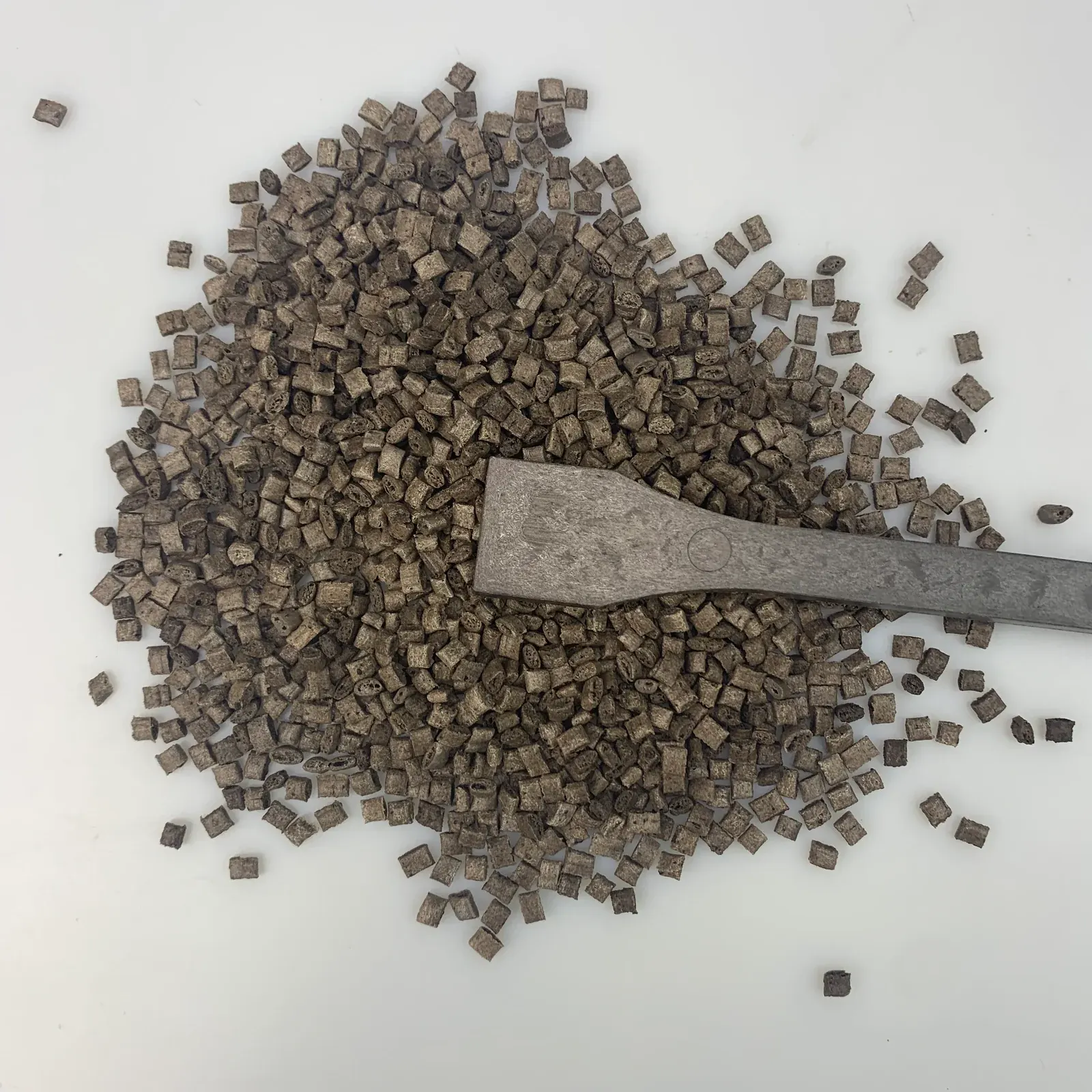 Coffee ground fiber ABS pellets with a molded test strip